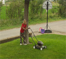 Karly mowing the lawn